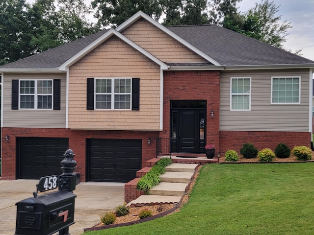 458 Fieldstone Dr, Ringgold, GA 30736 - bi-level home with concrete driveway, a garage, a front yard, and brick siding