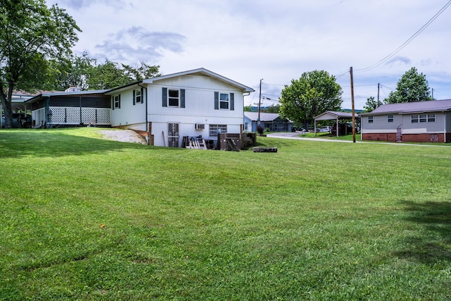 311 Birchwood St, Pikeville, TN 37367 - rear view of house featuring a lawn