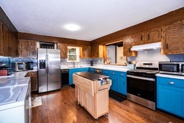 311 Birchwood St, Pikeville, TN 37367 - kitchen featuring stainless steel appliances, under cabinet range hood, light countertops, and decorative backsplash