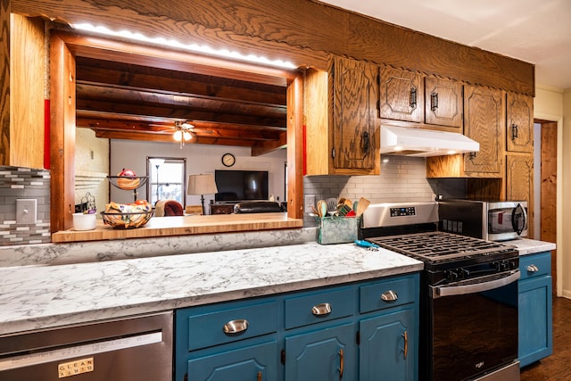 311 Birchwood St, Pikeville, TN 37367 - kitchen with stainless steel appliances, under cabinet range hood, blue cabinetry, light countertops, and ceiling fan