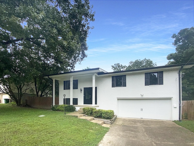 8127 Blue Spruce Dr, Hixson, TN 37343 - view of front of house featuring an attached garage, driveway, and brick siding