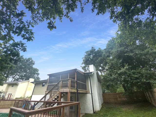 8127 Blue Spruce Dr, Hixson, TN 37343 - back of property featuring a sunroom, stairway, a chimney, and a wooden deck