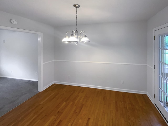 8127 Blue Spruce Dr, Hixson, TN 37343 - spare room featuring wood finished floors, a chandelier, and a smoke detector