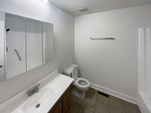 8127 Blue Spruce Dr, Hixson, TN 37343 - bathroom featuring a textured ceiling, vanity, and tile patterned floors