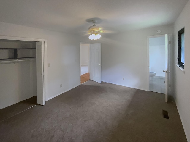 8127 Blue Spruce Dr, Hixson, TN 37343 - unfurnished bedroom featuring dark colored carpet, a closet, ceiling fan, and connected bathroom
