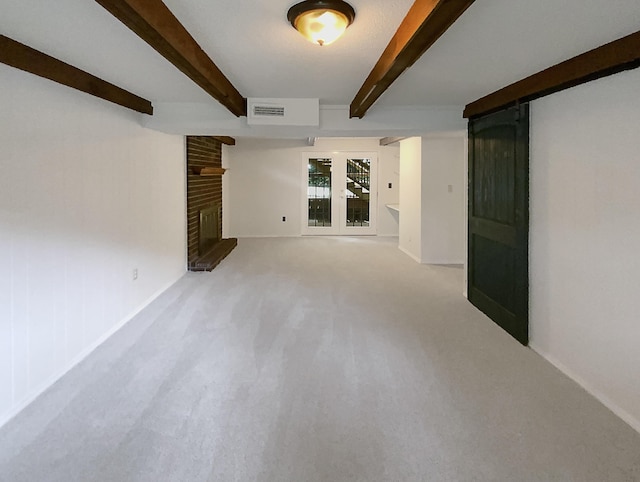 8127 Blue Spruce Dr, Hixson, TN 37343 - carpeted empty room with a fireplace and beam ceiling