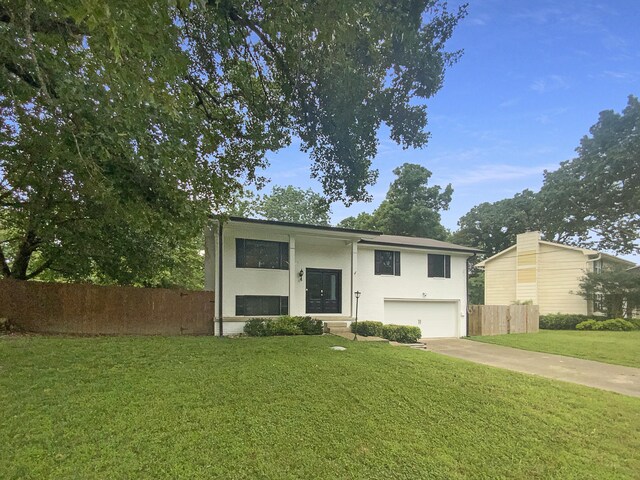 8127 Blue Spruce Dr, Hixson, TN 37343 - view of front facade with an attached garage, stucco siding, and driveway