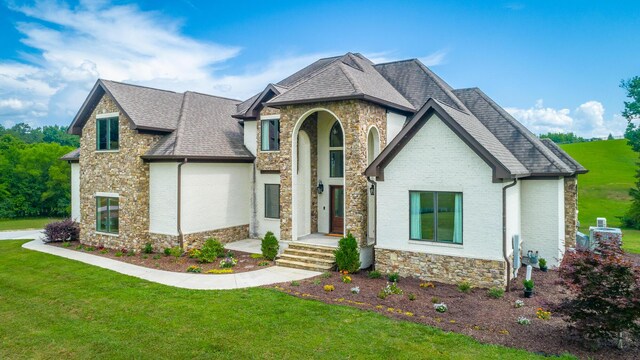 1524 Green Pond Rd, Soddy Daisy, TN 37379 - view of front of house with stone siding, a front lawn, roof with shingles, and an attached garage