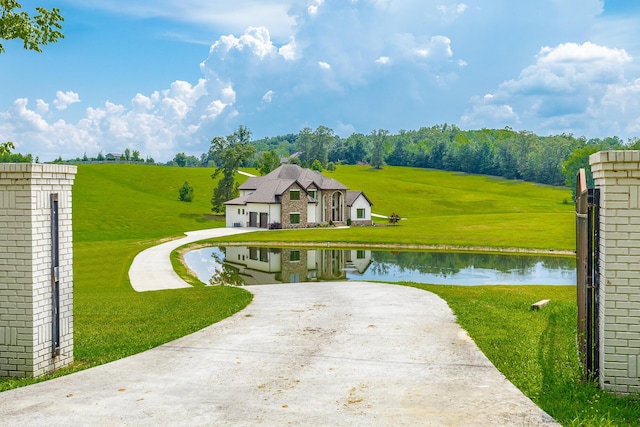 1524 Green Pond Rd, Soddy Daisy, TN 37379 - view of front facade featuring driveway, a water view, and a front yard