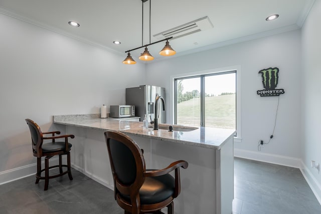 1524 Green Pond Rd, Soddy Daisy, TN 37379 - kitchen featuring stainless steel appliances, ornamental molding, a peninsula, a kitchen breakfast bar, and light stone counters