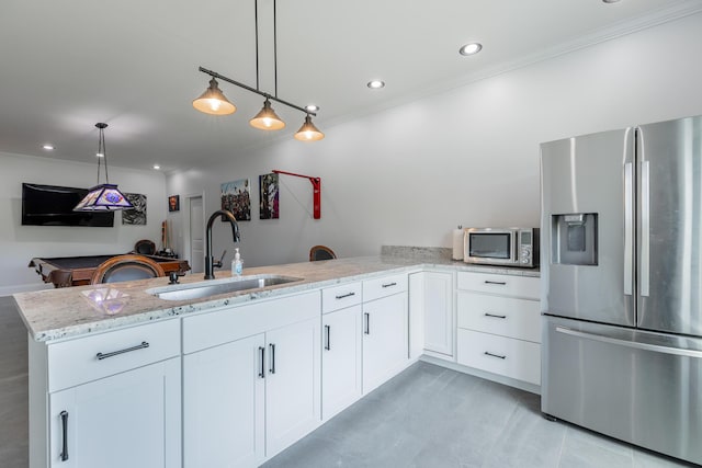 1524 Green Pond Rd, Soddy Daisy, TN 37379 - kitchen with stainless steel appliances, ornamental molding, a peninsula, light stone counters, and white cabinetry