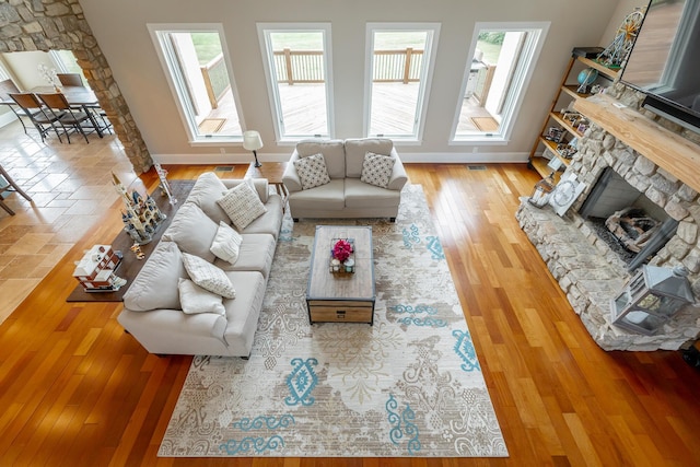 1524 Green Pond Rd, Soddy Daisy, TN 37379 - living area featuring a stone fireplace and wood finished floors