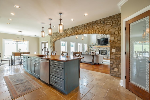 1524 Green Pond Rd, Soddy Daisy, TN 37379 - kitchen with gray cabinetry, stainless steel dishwasher, recessed lighting, stone tile flooring, and a center island with sink