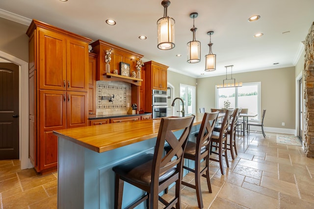 1524 Green Pond Rd, Soddy Daisy, TN 37379 - kitchen with stainless steel double oven, recessed lighting, crown molding, stone tile floors, and backsplash