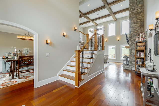 1524 Green Pond Rd, Soddy Daisy, TN 37379 - stairway featuring hardwood / wood-style flooring, beamed ceiling, a ceiling fan, coffered ceiling, and arched walkways
