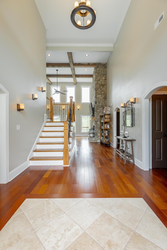 1524 Green Pond Rd, Soddy Daisy, TN 37379 - foyer featuring arched walkways, tile patterned flooring, stairs, beam ceiling, and recessed lighting
