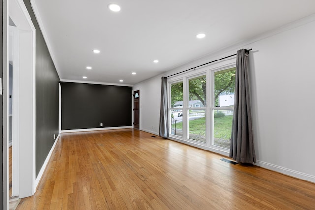 608 Maple Ln, Chattanooga, TN 37412 - unfurnished room with crown molding, light wood-style floors, and recessed lighting