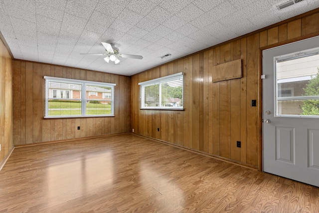 608 Maple Ln, Chattanooga, TN 37412 - unfurnished room featuring wood finished floors, ceiling fan, and wood walls