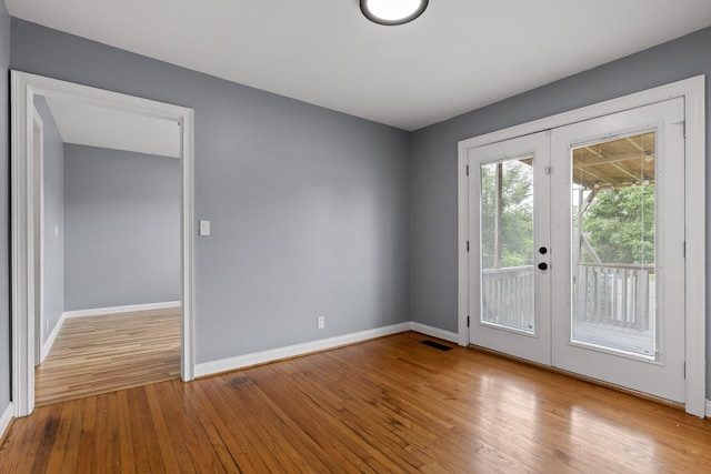 608 Maple Ln, Chattanooga, TN 37412 - spare room with french doors and hardwood / wood-style floors
