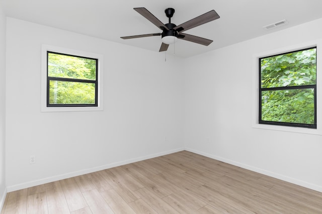 4217 W Rd, Signal Mountain, TN 37377 - spare room with healthy amount of natural light, light wood finished floors, and a ceiling fan