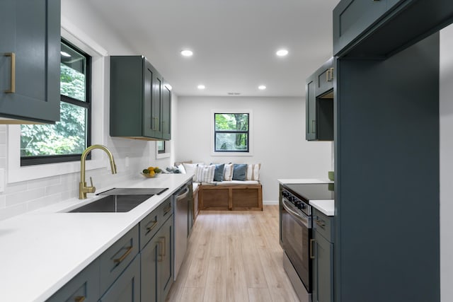 4217 W Rd, Signal Mountain, TN 37377 - kitchen featuring stainless steel appliances, light countertops, tasteful backsplash, light wood-style flooring, and recessed lighting