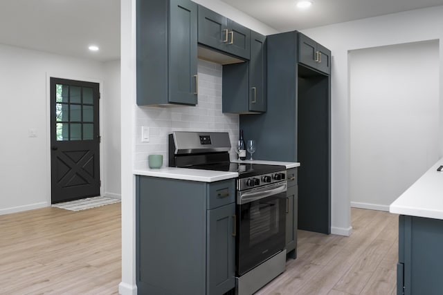 4217 W Rd, Signal Mountain, TN 37377 - kitchen with stainless steel range with electric cooktop, light wood-type flooring, light countertops, tasteful backsplash, and recessed lighting