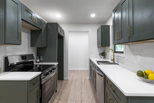 4217 W Rd, Signal Mountain, TN 37377 - kitchen with stainless steel appliances, light wood-style flooring, decorative backsplash, light countertops, and recessed lighting