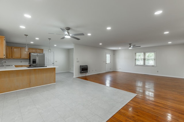 711 2nd St, South Pittsburg, TN 37380 - unfurnished living room featuring a ceiling fan, heating unit, recessed lighting, and light wood-type flooring