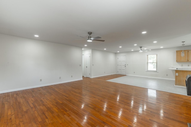 711 2nd St, South Pittsburg, TN 37380 - unfurnished living room with a ceiling fan, hardwood / wood-style flooring, and recessed lighting