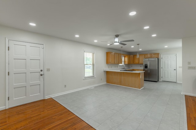 711 2nd St, South Pittsburg, TN 37380 - kitchen featuring stainless steel fridge, a peninsula, light countertops, ceiling fan, and recessed lighting
