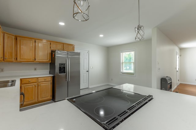 711 2nd St, South Pittsburg, TN 37380 - kitchen with stainless steel refrigerator with ice dispenser, light countertops, recessed lighting, stovetop with downdraft, and hanging light fixtures