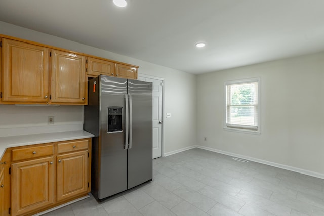 711 2nd St, South Pittsburg, TN 37380 - kitchen featuring stainless steel fridge, light countertops, recessed lighting, and light tile patterned floors