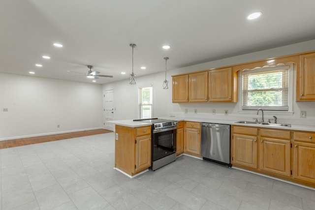 711 2nd St, South Pittsburg, TN 37380 - kitchen featuring appliances with stainless steel finishes, light countertops, a peninsula, recessed lighting, and a ceiling fan