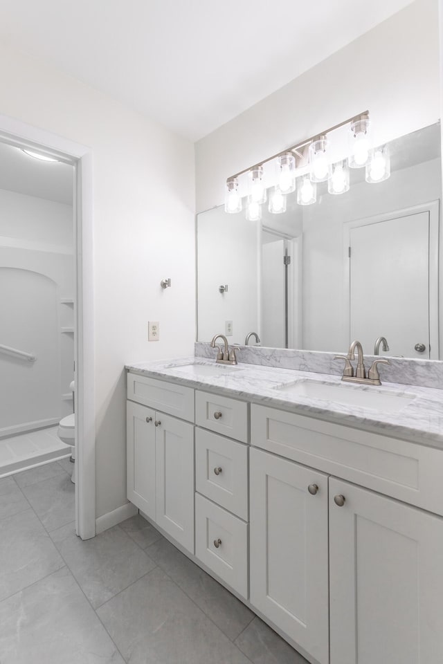 711 2nd St, South Pittsburg, TN 37380 - bathroom with double vanity and toilet
