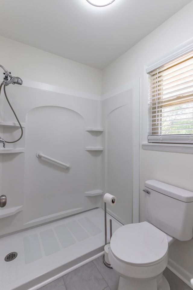 711 2nd St, South Pittsburg, TN 37380 - bathroom with a stall shower and tile patterned flooring