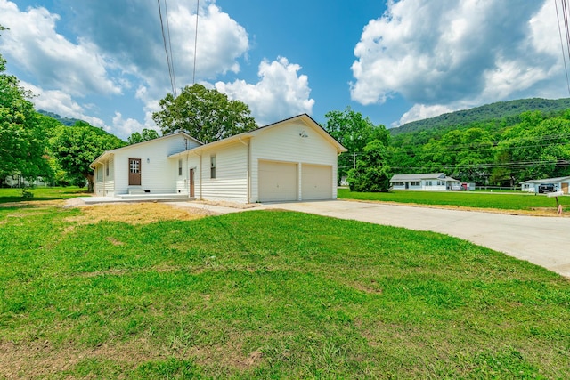 711 2nd St, South Pittsburg, TN 37380 - single story home with concrete driveway and a front lawn
