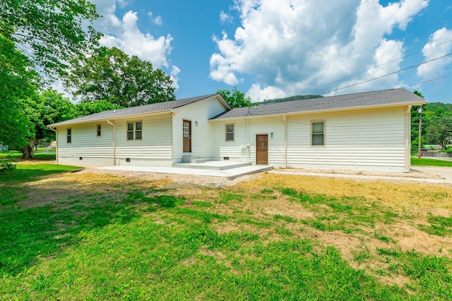 711 2nd St, South Pittsburg, TN 37380 - rear view of property with a patio, crawl space, and a lawn
