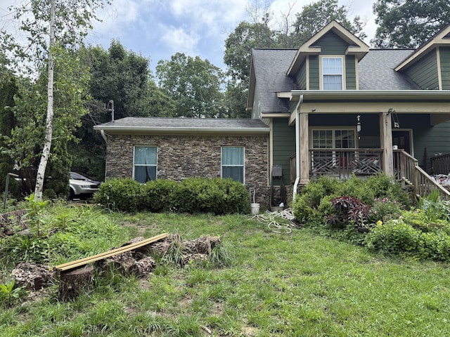 5492 Henson Gap Rd, Dunlap, TN 37327 - view of front of house with stone siding, roof with shingles, and covered porch