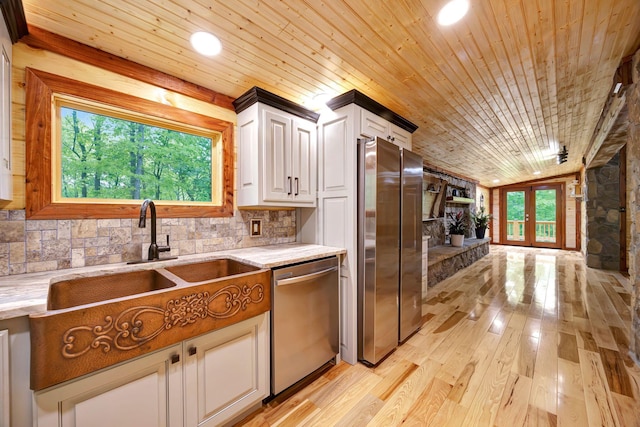 1590 Jackson Point Rd, Sewanee, TN 37375 - kitchen with appliances with stainless steel finishes, wooden ceiling, light wood-style floors, white cabinetry, and tasteful backsplash