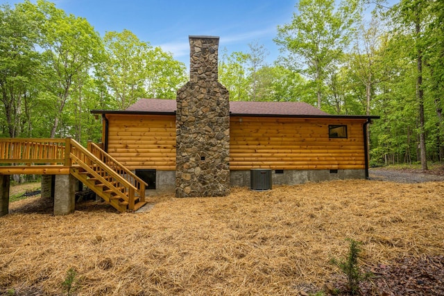 1590 Jackson Point Rd, Sewanee, TN 37375 - back of house with crawl space, stairway, a deck, roof with shingles, and faux log siding