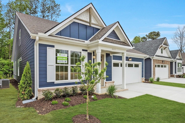 LOT3 Ari Ln, Chattanooga, TN 37421 - view of front of house with an attached garage, roof with shingles, a front lawn, concrete driveway, and board and batten siding