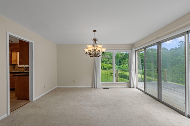 4838 Glenmar Cir, Chattanooga, TN 37416 - spare room with light carpet and a chandelier