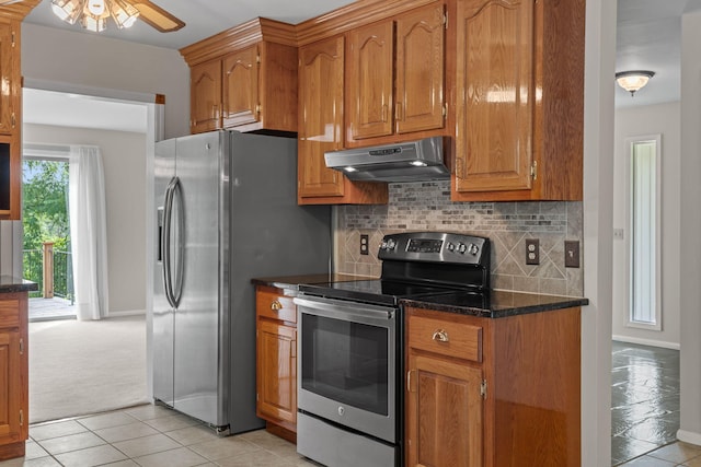 4838 Glenmar Cir, Chattanooga, TN 37416 - kitchen featuring appliances with stainless steel finishes, under cabinet range hood, ceiling fan, and brown cabinetry