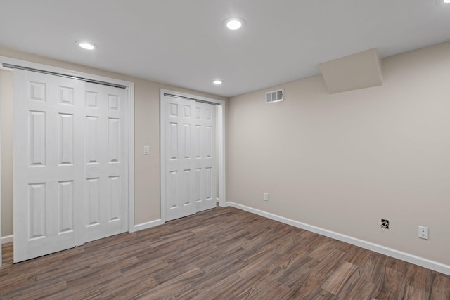 4838 Glenmar Cir, Chattanooga, TN 37416 - unfurnished bedroom with multiple closets, dark wood-style floors, and recessed lighting