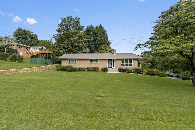 4838 Glenmar Cir, Chattanooga, TN 37416 - view of front facade with a front lawn, a chimney, and brick siding