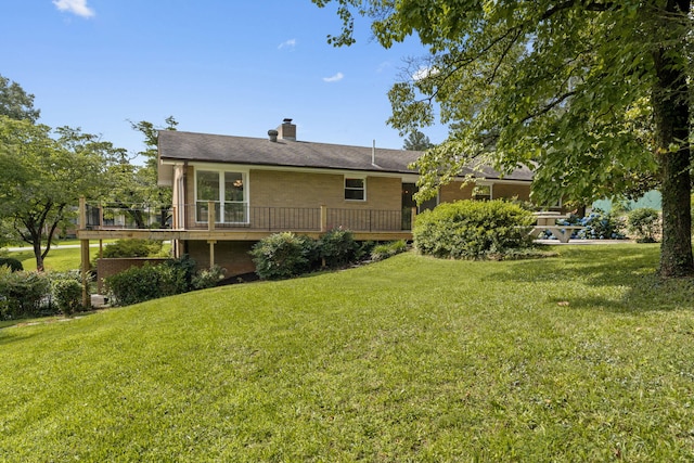 4838 Glenmar Cir, Chattanooga, TN 37416 - back of house with a wooden deck, a yard, and a chimney