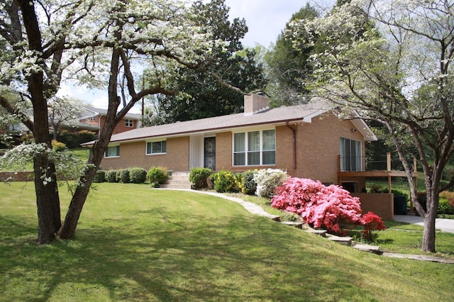 4838 Glenmar Cir, Chattanooga, TN 37416 - ranch-style house with brick siding, a chimney, and a front yard