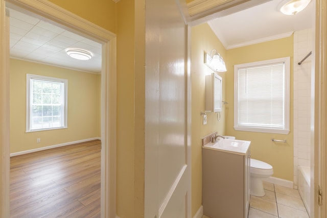 129 N Moore Rd, Chattanooga, TN 37411 - bathroom featuring ornamental molding, vanity, washtub / shower combination, and wood finished floors