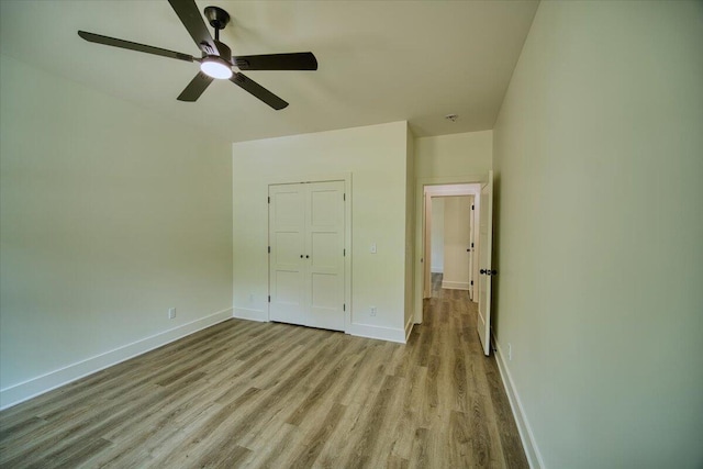824 Lower Mill Rd, Hixson, TN 37343 - unfurnished bedroom featuring light wood-style floors and ceiling fan
