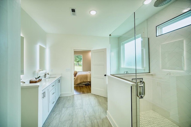 824 Lower Mill Rd, Hixson, TN 37343 - ensuite bathroom featuring a shower stall, double vanity, and plenty of natural light
